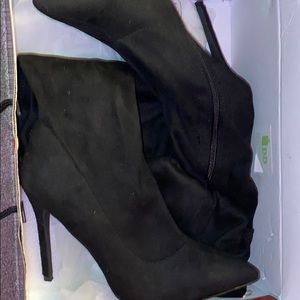Knee high black heel boots